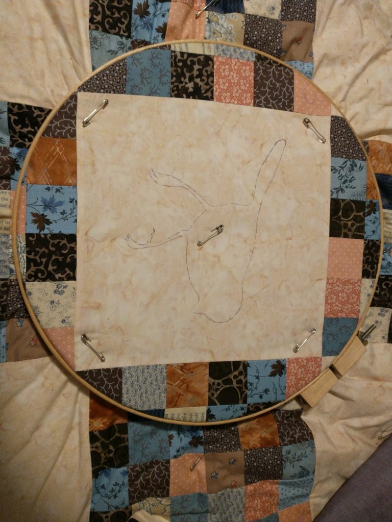 robin drawn on quilt